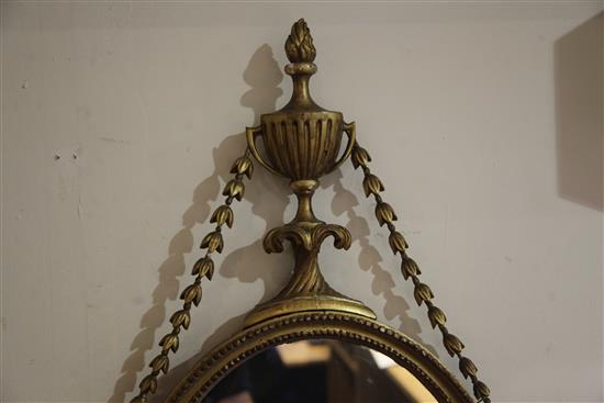 A pair of George III giltwood and gesso oval wall mirrors, W.1ft 5in. H.2ft 7.5in.